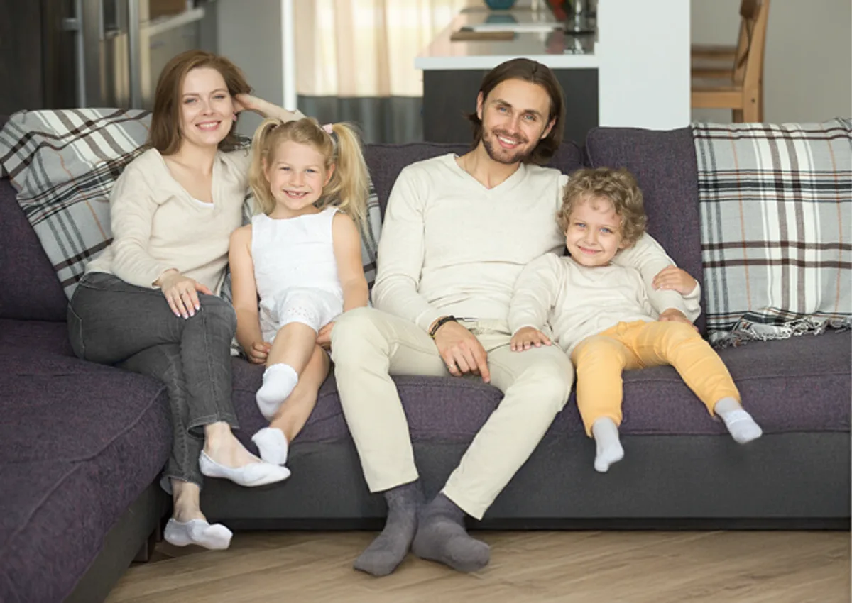 Happy family sitting on sofa